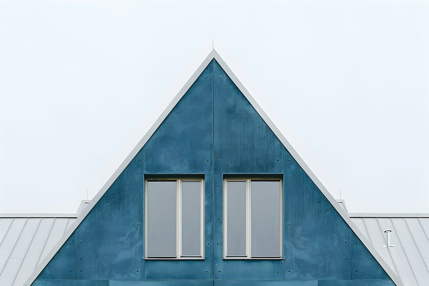 Steep gable dormer with a standing seam metal roof